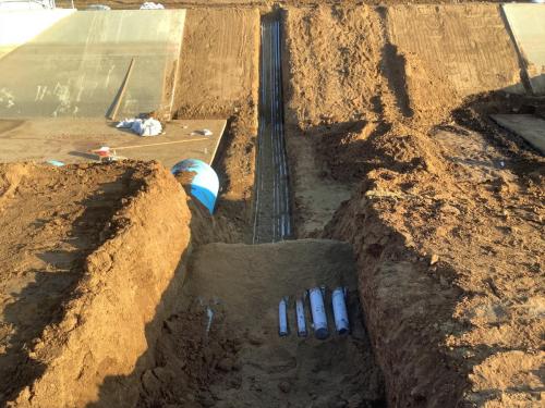 Open Electrical Conduit trench across Fresno Canal