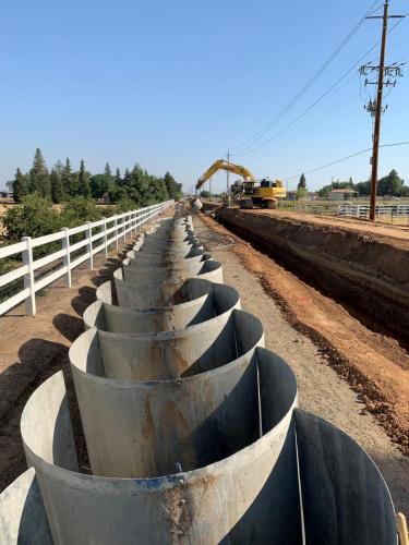72" Cast In Place Pipe forms neatly organizing in a row along the shoulder of McCall Avenue.